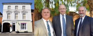 Trueman & Grundy Shop Front & Team